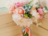 a springy wedding bouquet of neutral, light pink and peachy blooms plus succulents and ribbons