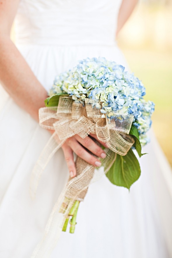 a blue hydrangea wedding bouquet with mesh ribbons for a slight rustic touch in your bridal style