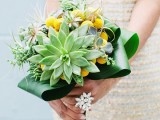 a bright spring wedding bouquet with succulents, air plants and craspedia for a bold bridal look