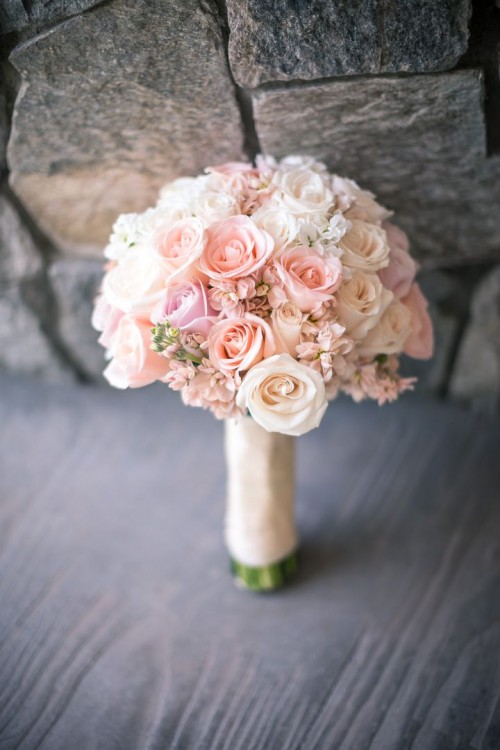 a light pink and blush wedding bouquet with a neutral handle for a tender spring bride