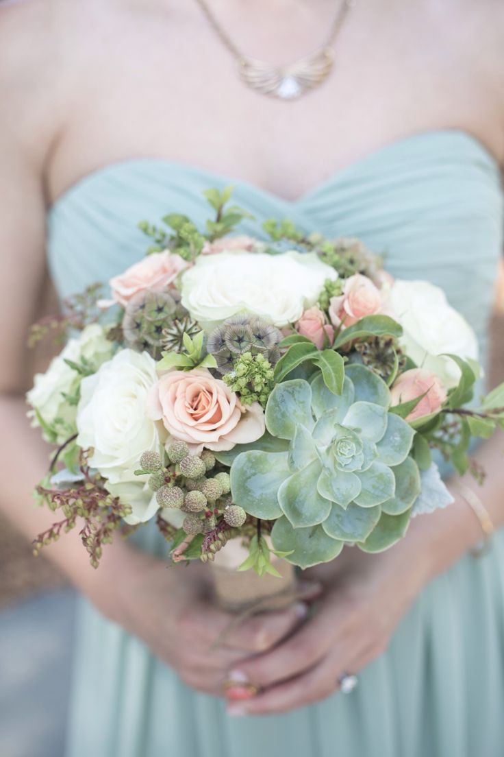 a chic spring wedding bouquet of white and blush blooms, greenery and succulents for a spring bride