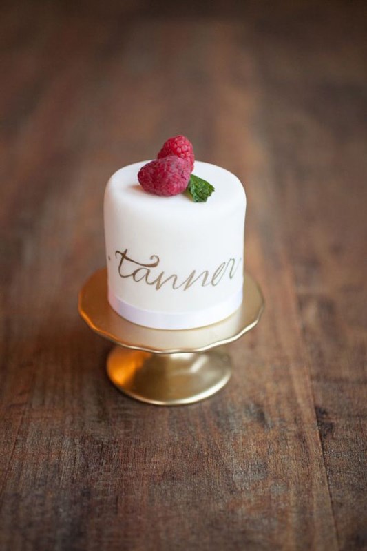 an individual wedding cake topped with fresh berries and with the name on it is a lovely idea for a groom's cake