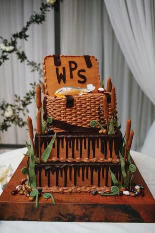 a unique groom's cake showing a basket chest with a fish caught and some greenery around is great for a person who loves fishing