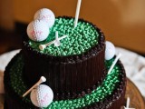 a chocolate wedding cake topped with sugar golf balls and other pieces is ideal for a keen golf player