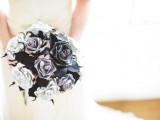 a black and white paper rose wedding bouquet is a bold and contrasting idea for a bride