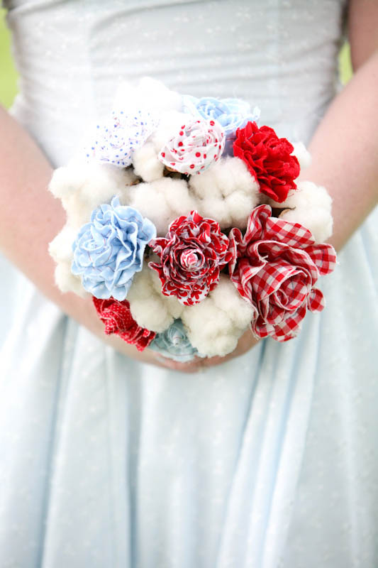 A whimsy wedding bouquet composed of cotton, blue, red plaid, polka dot fabric blooms is a veyr fun and bold idea