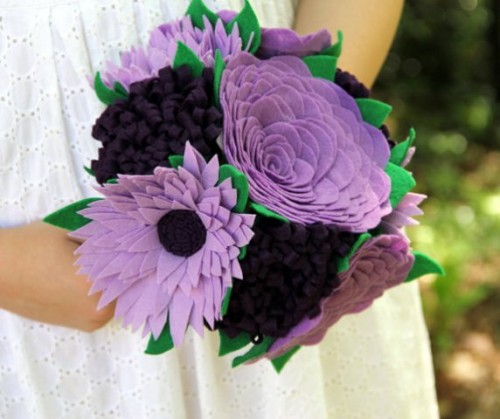 a bold bouquet of fabric blooms in purple and black and fabric green leaves is a very fresh and cool idea to rock