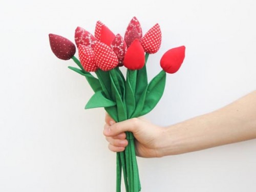 a bright red fabric tulip wedding bouquet is a fun and cool idea for a spring bride