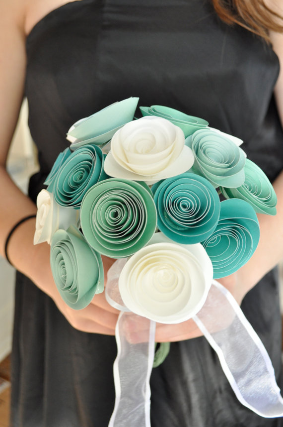 A bold ribbon wedding bouquet with turquoise and white flowers and sheer ribbons is a very creative and cool wedding bouquet