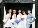 bridesmaids wearing over the knee white A-line dresses and a bridesman wearing a blue pantsuit – such pantsuits can be rocked by everyone