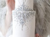 a glam winter wedding cake with patterns and grey edible beads and detailing is an amazing idea