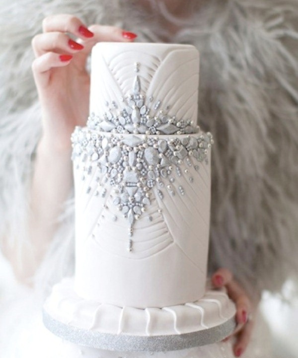 A glam winter wedding cake with patterns and grey edible beads and detailing is an amazing idea