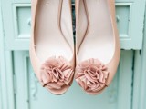 tan wedding shoes with matching fabric blooms and peep toes are stylish and will match many bridal looks