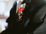 a winter boutonniere of a pale leaf, red blooms, berries will bring a touch of color to the look