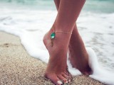 a delicate chain anklet with an emerald rhinestone is a gorgeous idea for a boho and mermaid bride