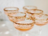 amber cocktails in glasses with a gold leaf edge are perfect signature drinks for a fall wedding