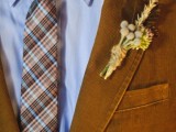 a rust colored velvet blazer and a bright plaid tie for a stylish fall groom look