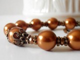 a copper bracelet of beads and rhinestones is a stylish idea for a romantic fall bride or bridesmaid