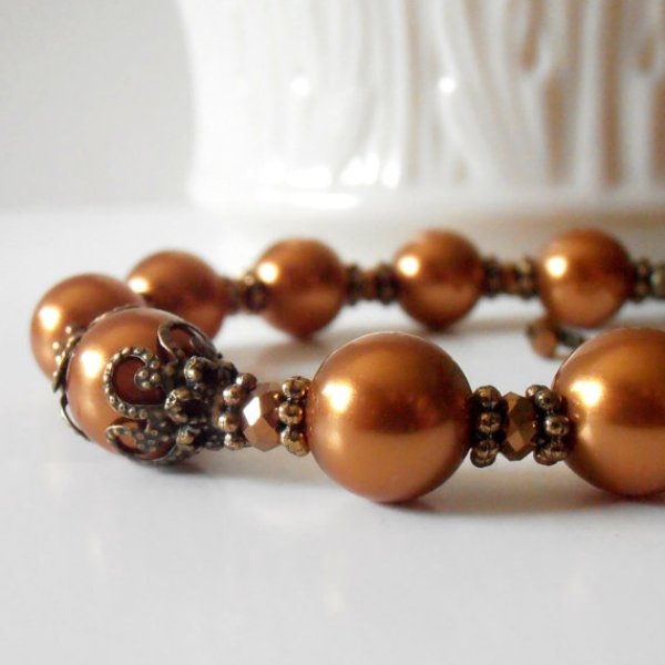 A copper bracelet of beads and rhinestones is a stylish idea for a romantic fall bride or bridesmaid