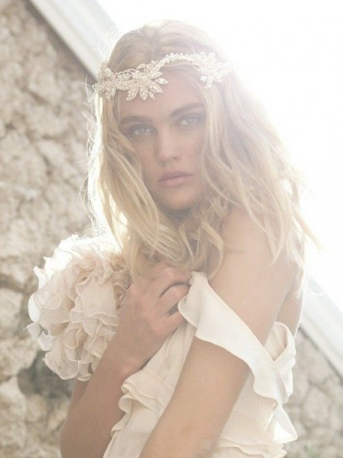 a lace and pearl floral headpiece is a cool boho chic idea for a glam boho bride