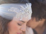 a tulle headpiece with embroidery and crystals is a very romantic and very bold idea for a boho chic bride