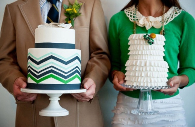 a white buttercream wedding cake with black and green chevron decor is a stylish idea for a modern or mid-century modern wedding