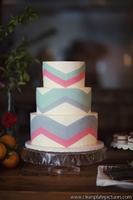 a white mid-century modern wedding cake with navy, pink and mint blue chevrons is a lovely idea for a mid-century modern wedding with plenty of color