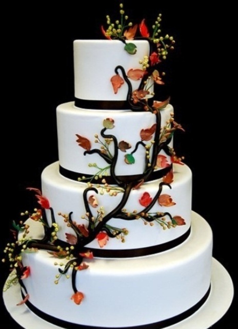 a white wedding cake decorated with a sugar branch and leaves and some blooms is a simple and cute idea