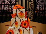 a fall wedding cake decorated with sugar branches and blooms is a stylish idea for the fall