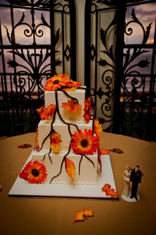 a fall wedding cake decorated with sugar branches and blooms is a stylish idea for the fall
