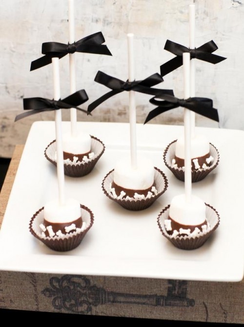 marshmallows with chocolate and nuts on sticks are creative and budget-friendly Halloween wedding favors