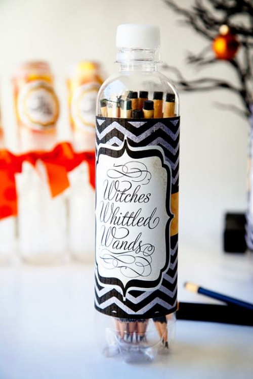 long and thin cookies in a bottle styled as witches' witted wands are unique and bold Halloween wedding favors