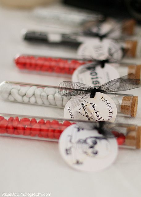 test tubes with white and red candies and tags with bows are nice and easy Halloween wedding favors