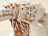 striped orange, black and white candies with tags are nice for Halloween weddings and won’t break the bank