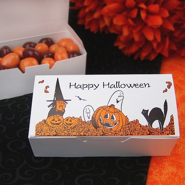 A Halloween box with brown and orange candies is a cool wedding favor idea to rock