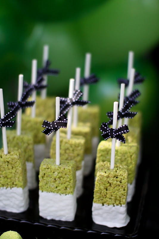 Krispie rice pops with bows are cute and bold Halloween wedding favors you can make yourself