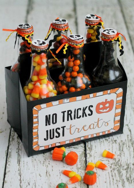 bottles filled with colorful and black candies are cool and easy Halloween wedding favors that will please everyone