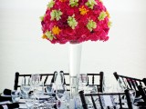 a black and white tablescape with patterns and a bright floral centerpiece for a colorful touch