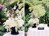 a black vase with lush white blooms will be a nice wedding centerpiece