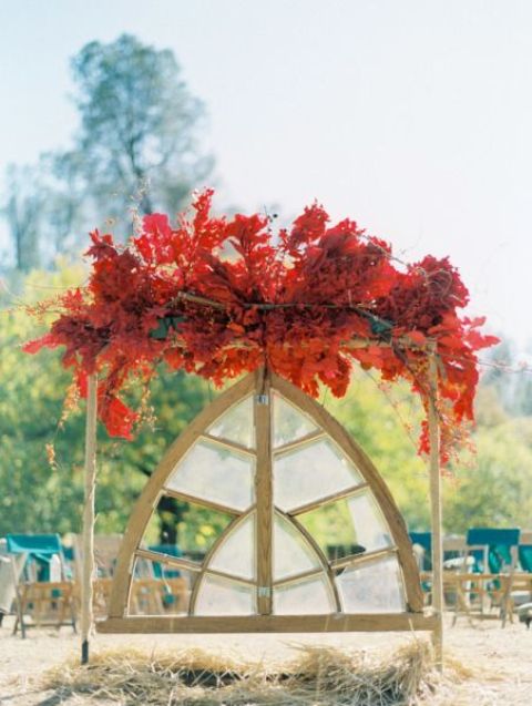a unique fall wedding decoration with lush red leaves and blooms will make a statement and will help you embrace the season