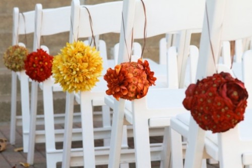 bright floral pomanders to decorate the aisle is a fun and bold idea for aisle decor