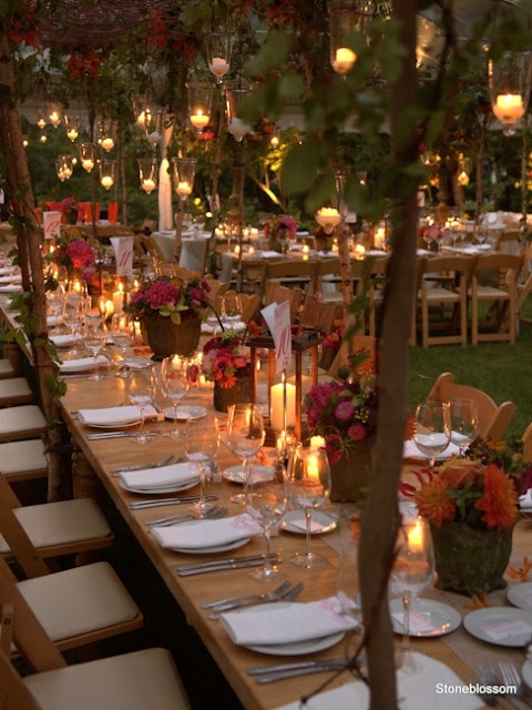 bright fall floral arrangements in buckets, greenery and floral installation with candles