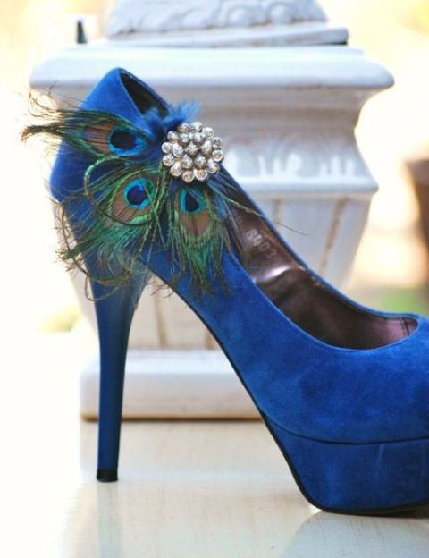 bright blue wedding shoes accented with peacock feathers and vintage brooches