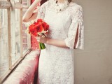 a short lace hippie-inspired wedding dress with bell sleeves with cuts and a high neckline is very cool and bold
