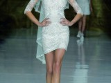 a lace embellished sheath wedding dress with an illusion neckline and short sleeves plus a floral crown with a veil for a modern glam bride