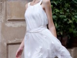 a breezy and airy white short wedding dress, a scoop neckline, no sleeves and floral appliques is very cool and free-spirited