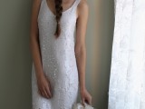 a beautiful embellished art deco wedding dress with no sleeves, a scoop neckline and fringe is very bright and glam
