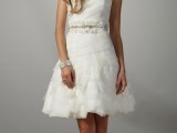 a strapless short draped and tiered wedding dress with an embellished sash for a playful and fun look