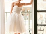 a strapless A-line wedding dress with a draped bodice and a pleated skirt for a vintage-inspired bridal look
