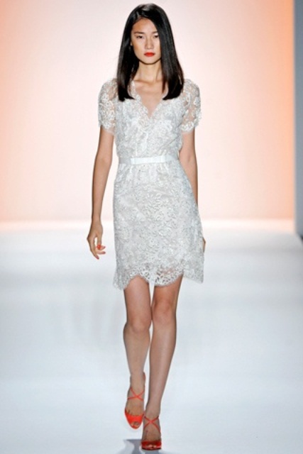 a short sheath lace mini wedding dress with short sleeves, red shoes and a red lipstick for a statement modern look